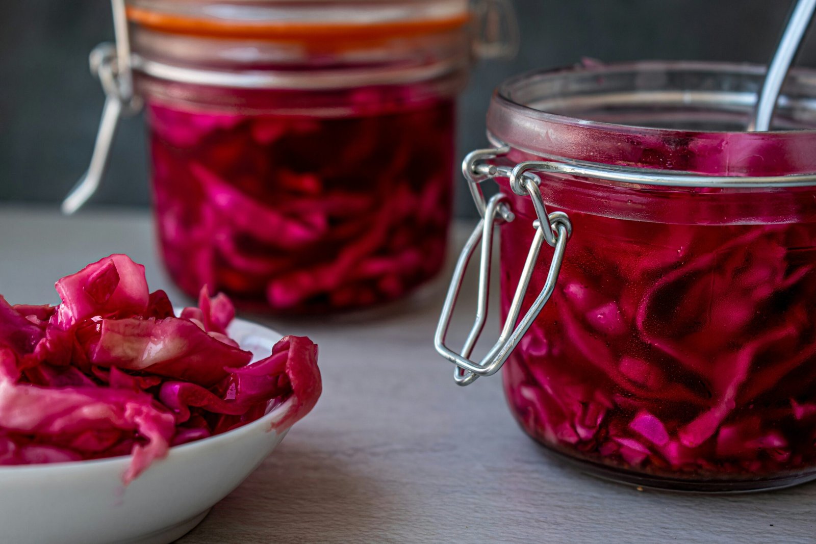 red liquid in clear glass jar